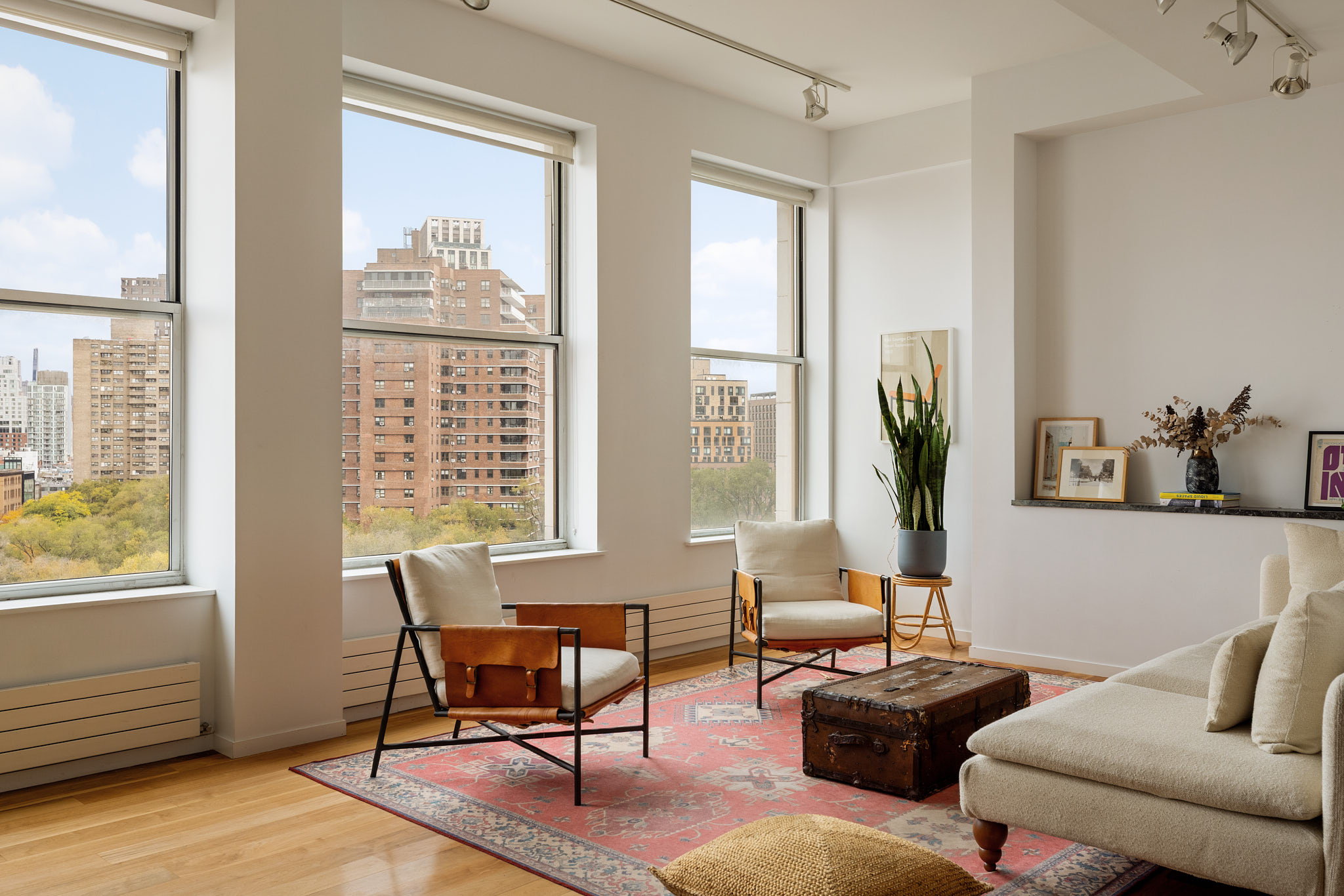 175 East Broadway, Unit 8A Manhattan, NY 10002 - Photo 2 of 11 a living room with furniture and a large window