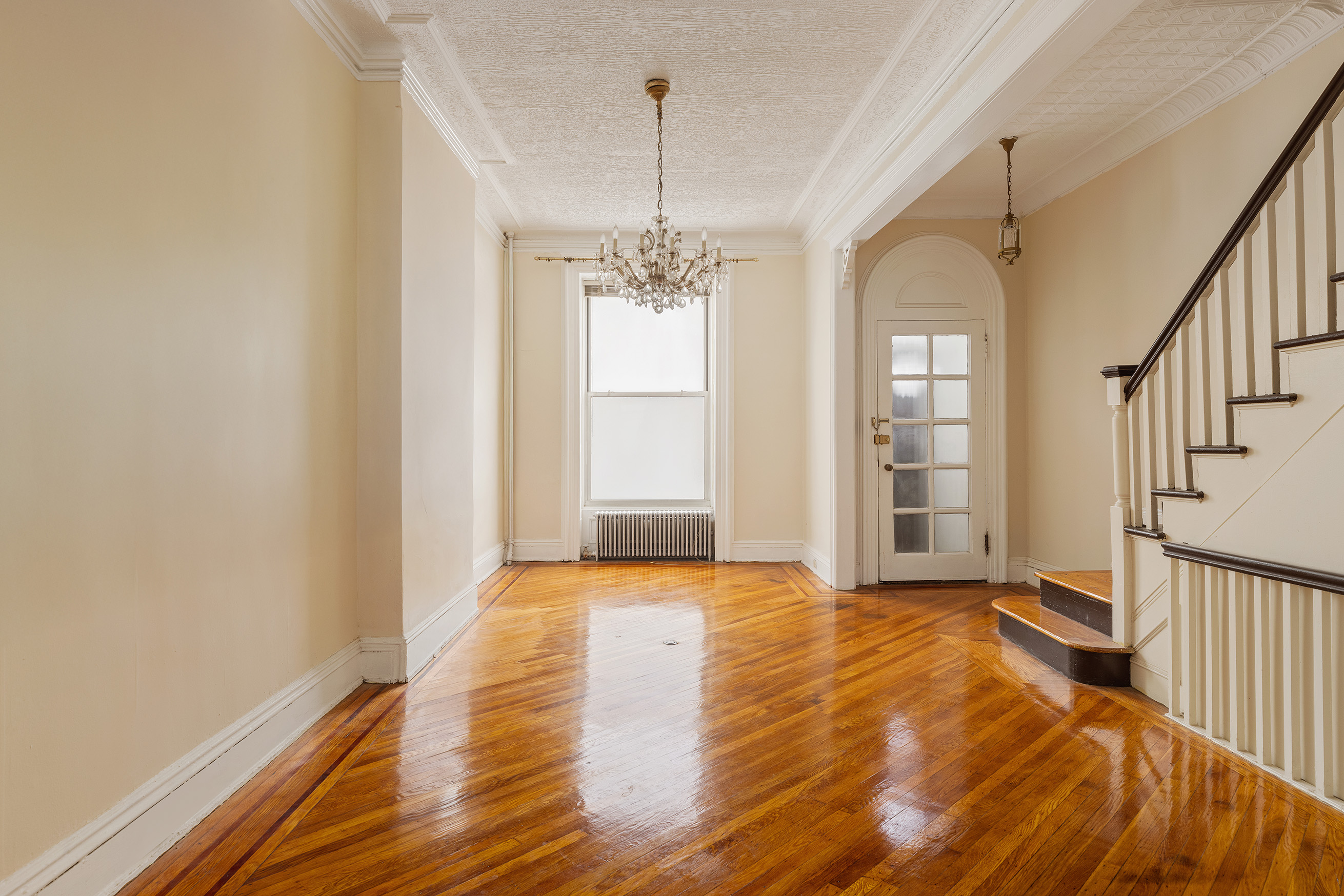 116 Brooklyn Avenue Brooklyn, NY 11216 - Photo 3 of 21 a view of livingroom with window and hardwood floor
