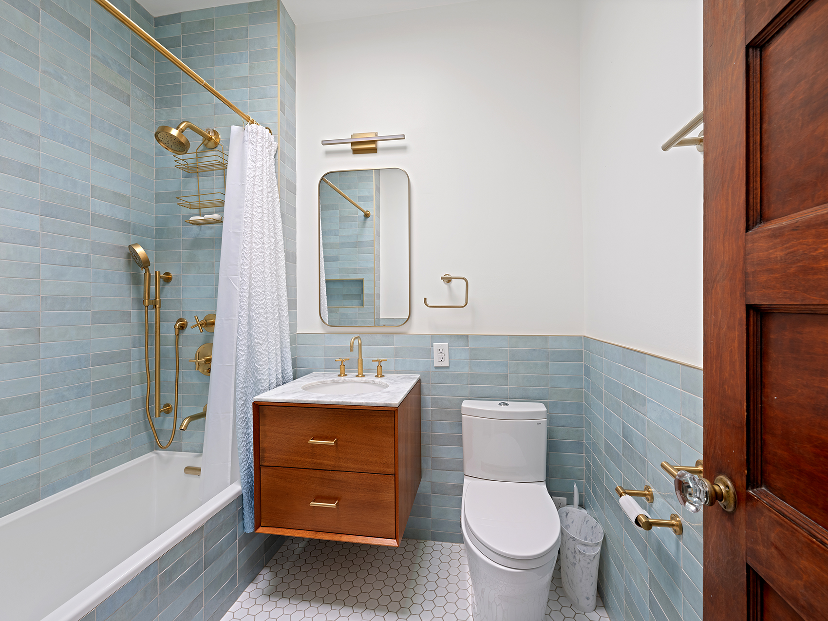 207 Windsor Place Brooklyn, NY 11215 - Photo 14 of 20 a bathroom with a toilet sink and mirror