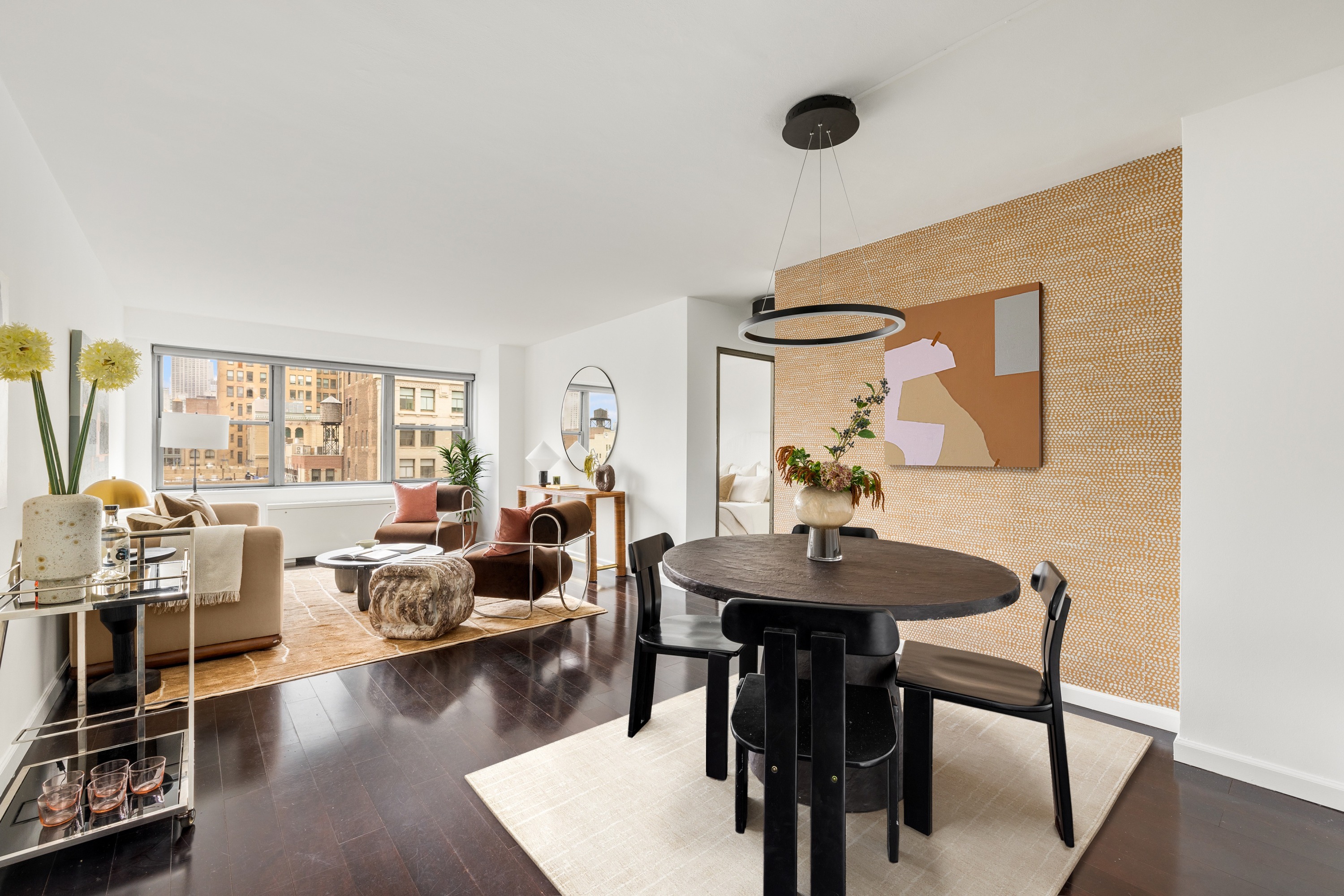 10 West 15th Street, Unit 1721 Manhattan, NY 10011 - Photo 2 of 10 a living room with furniture and a wooden floor