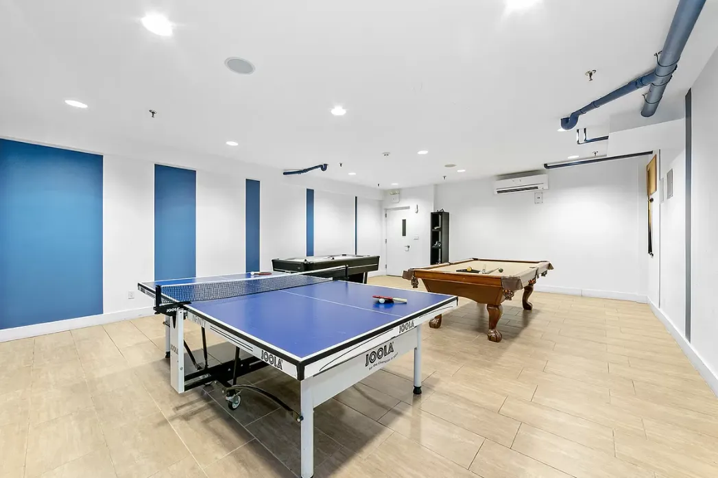 a room with furniture pool table and table