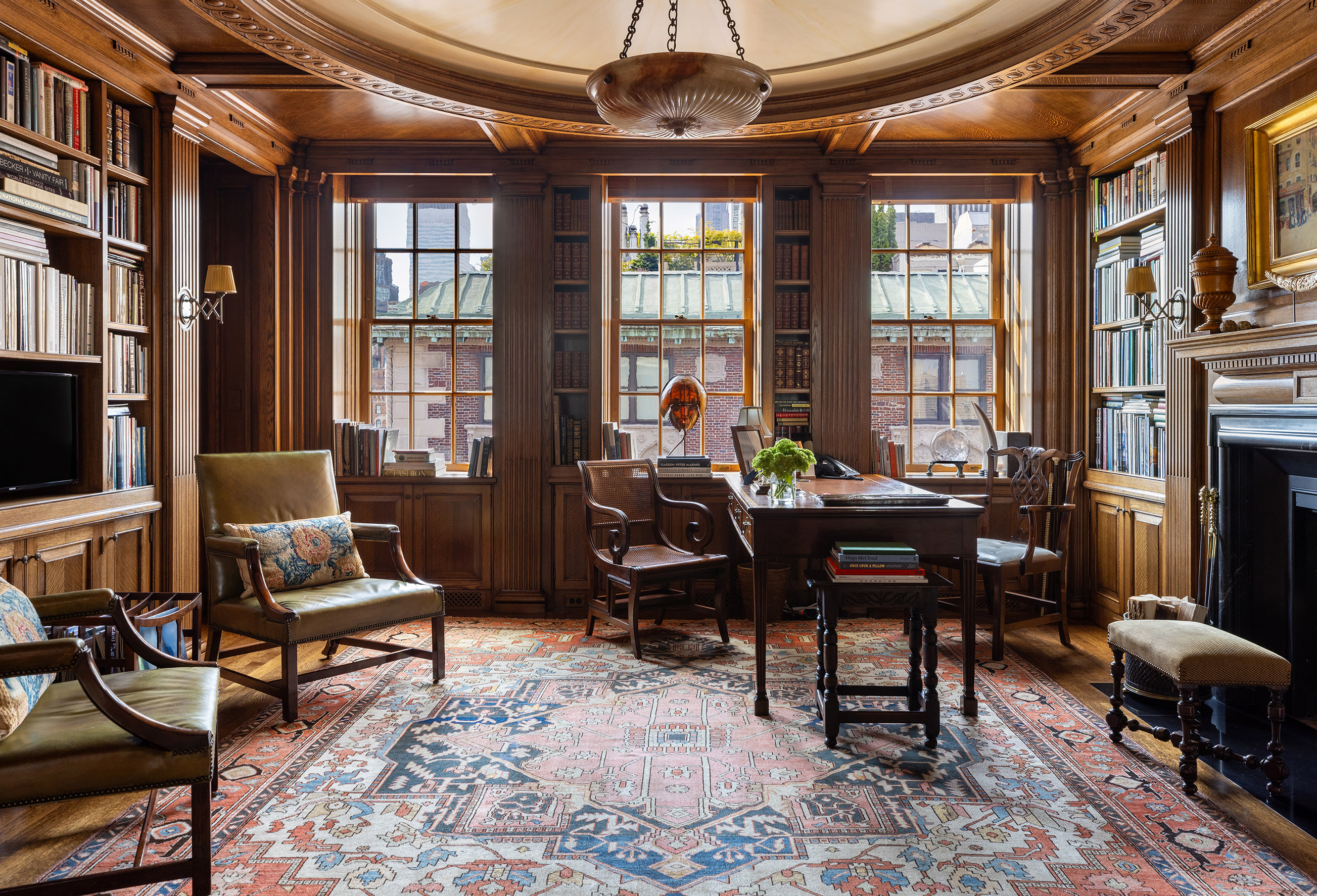 620 Park Avenue, Unit 14 Manhattan, NY 10065 - Photo 20 of 32 a living room with furniture a flat screen tv and a window