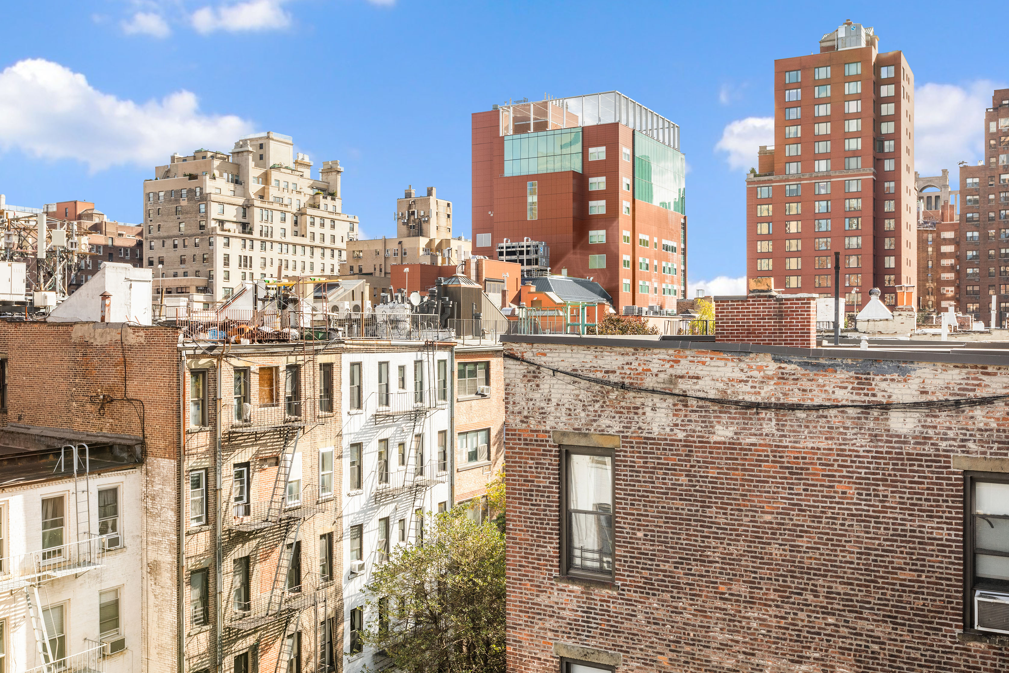 1582 York Avenue, Unit 5B Manhattan, NY 10028 - Photo 8 of 14 a city view with tall buildings