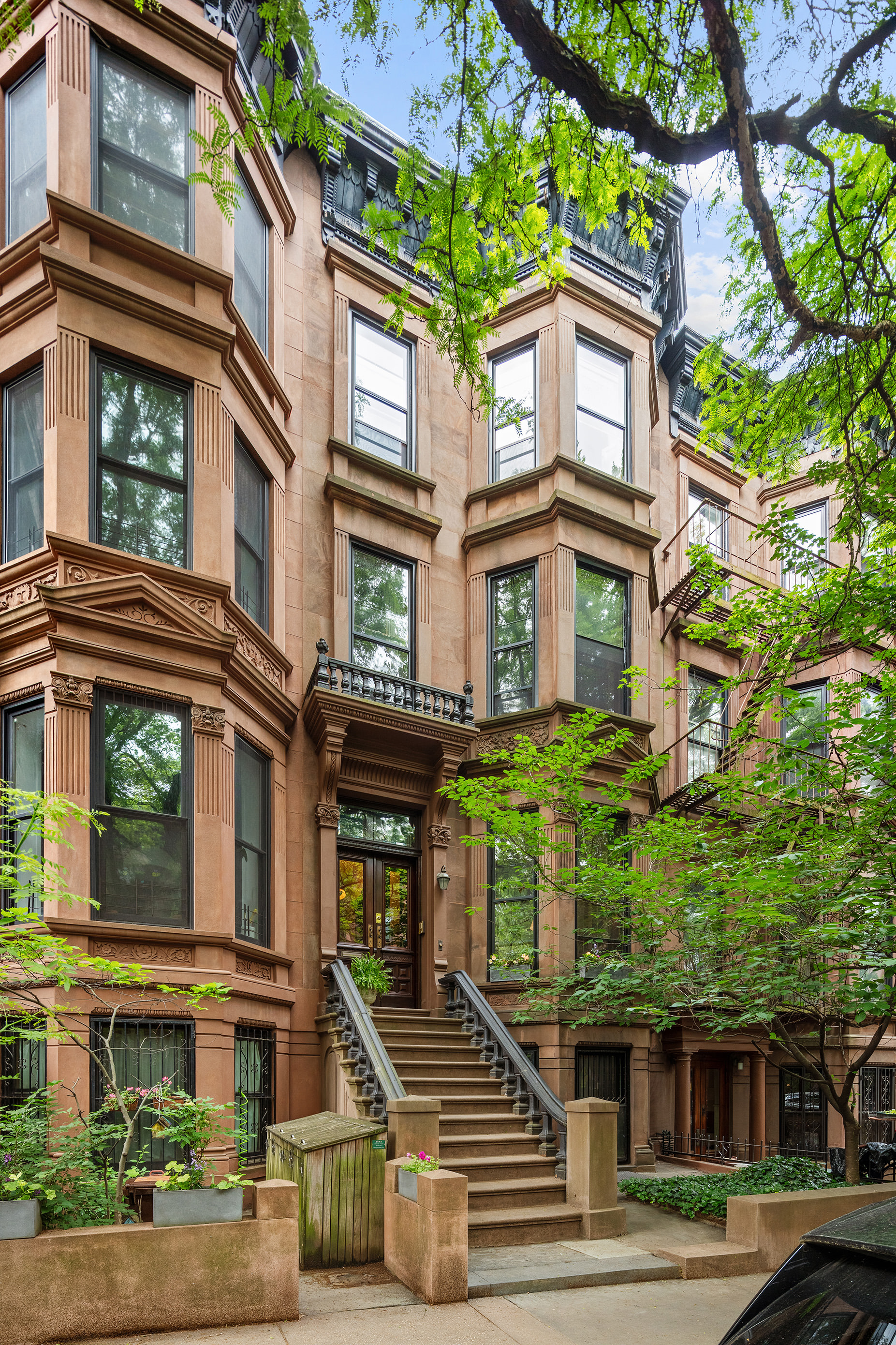 836 President Street Brooklyn, NY 11215 - Photo 19 of 23 a front view of a residential apartment building with a yard