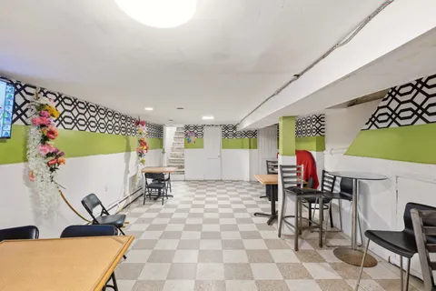 a work room with furniture and a table