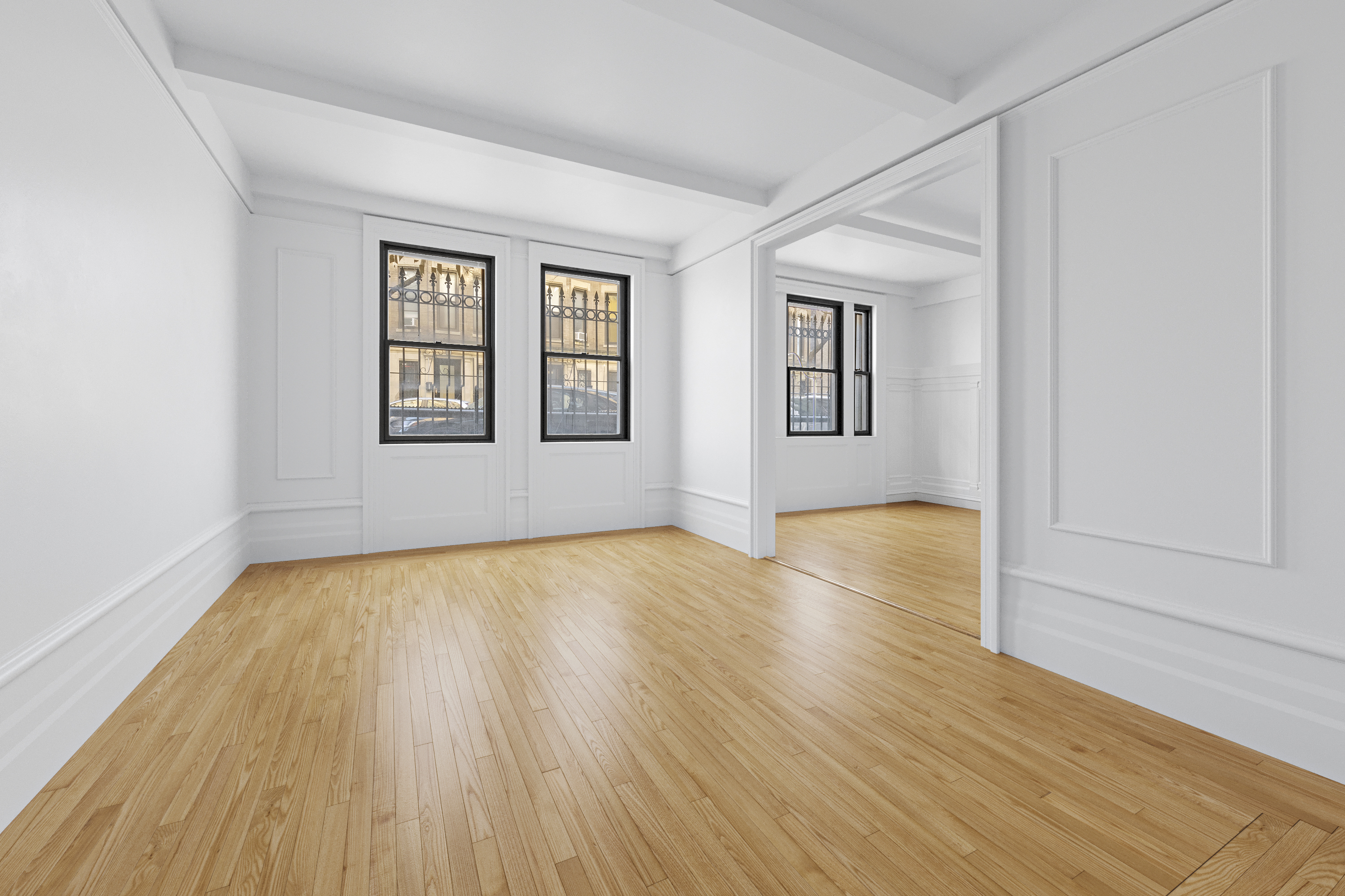609 West 114th Street, Unit 2 Manhattan, NY 10025 - Photo 2 of 16 an empty room with wooden floor and windows