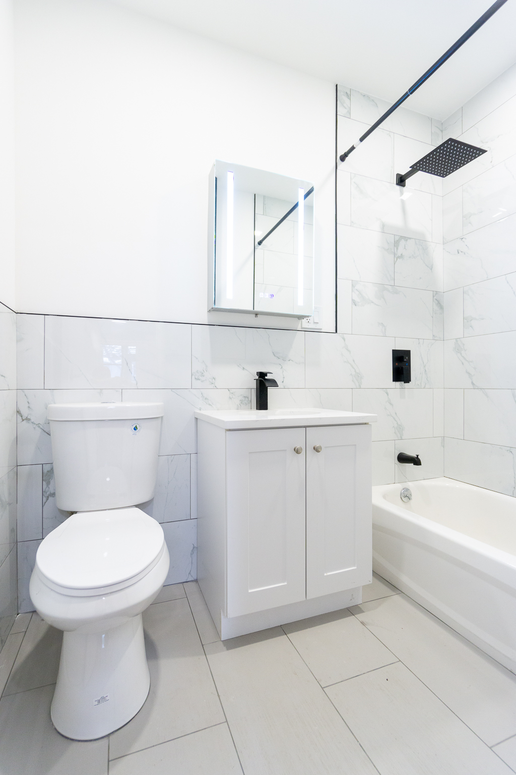 339 East 6th Street, Unit B Manhattan, NY 10003 - Photo 15 of 22 a bathroom with a sink a toilet and bathtub