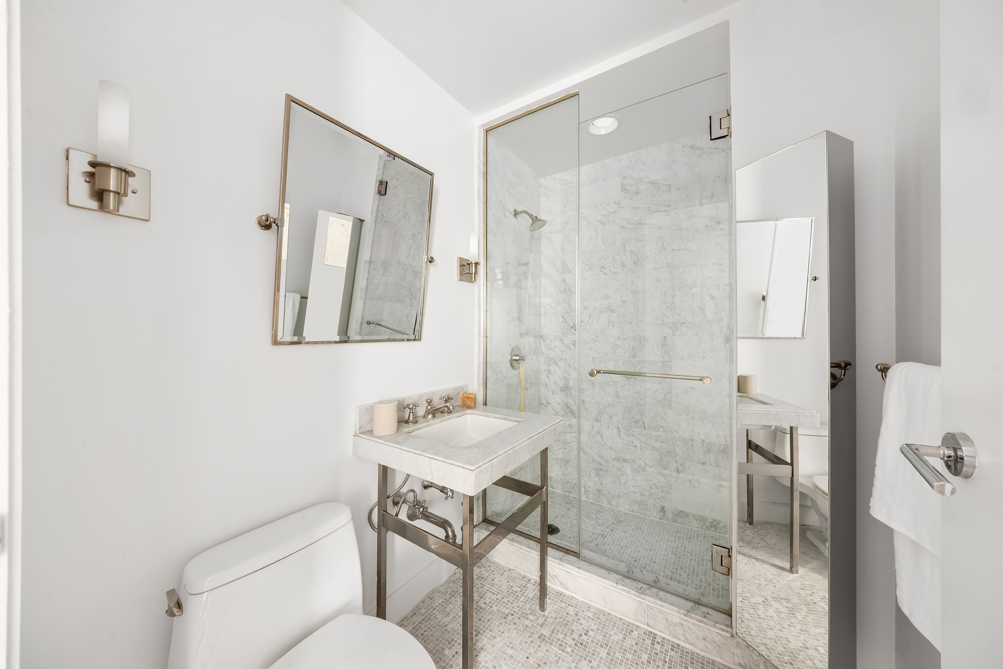 408 East 79th Street, Unit 14B Manhattan, NY 10075 - Photo 13 of 18 a bathroom with a sink toilet and shower