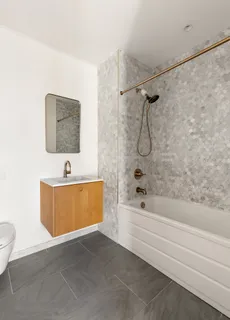 a room with a table and mirror