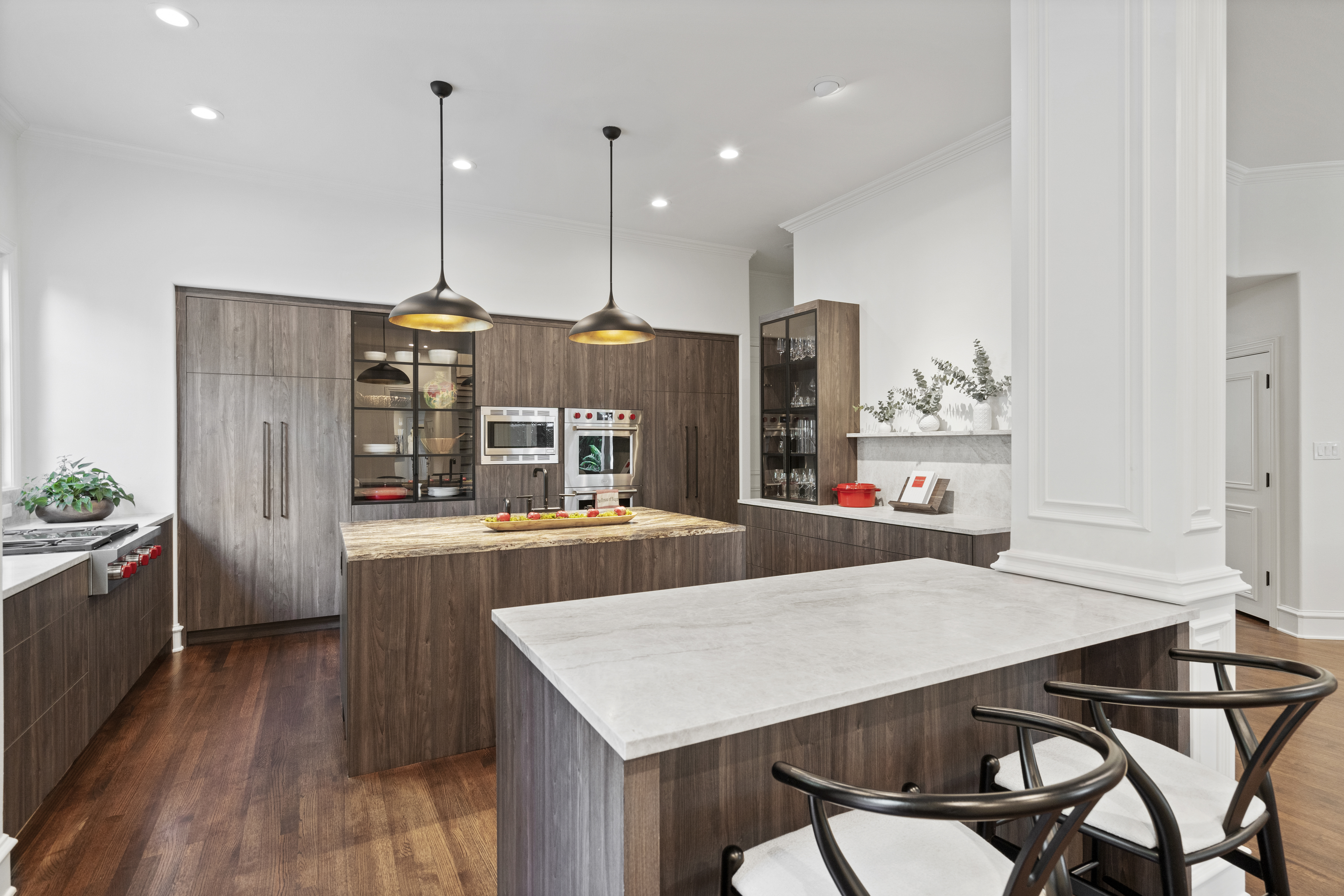 6607 Meadow Road Dallas, TX 75230 - Photo 10 of 32 a living room with stainless steel appliances kitchen island granite countertop furniture wooden floor and a view of kitchen