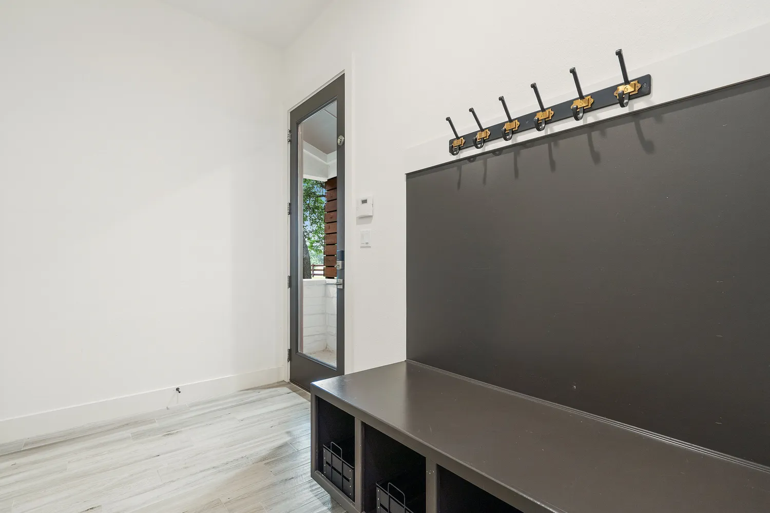 an aerial view of a house with a garden and lake view