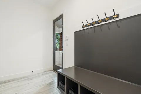 an aerial view of a house with a garden and lake view