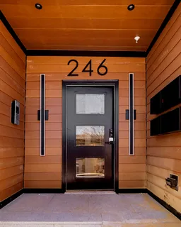 a front view of a building with a garage