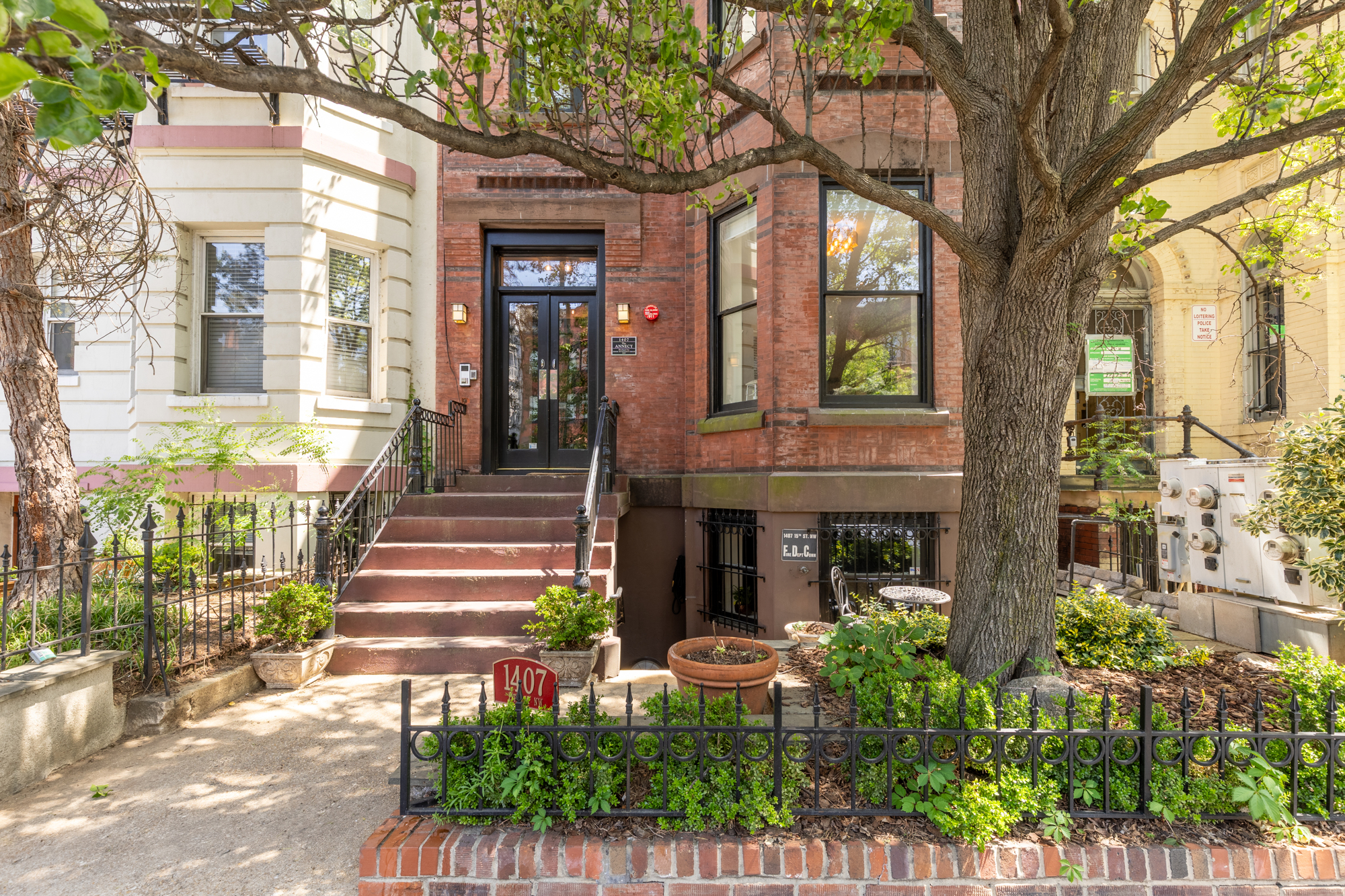 1407 15th Street Northwest, Unit 2 Washington, DC 20005 - Photo 2 of 24 a front view of a house with a garden