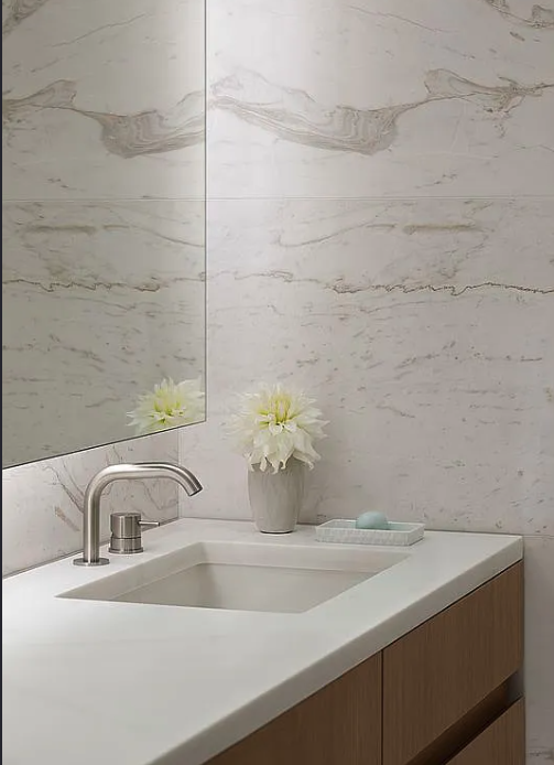 611 West 56th Street, Unit 6D Manhattan, NY 10019 - Photo 2 of 10 a bathroom with a sink and a shower