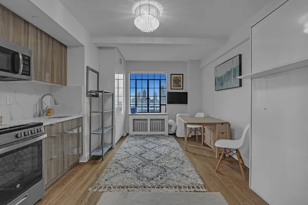a kitchen with a stove a sink and a refrigerator