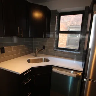 a kitchen with a sink and a window