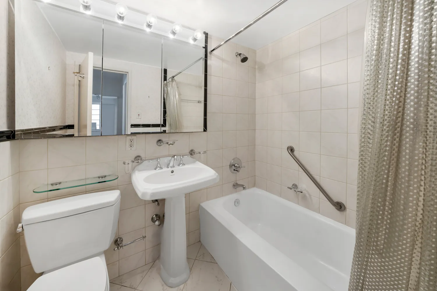 a bathroom with a sink a toilet and a bathtub