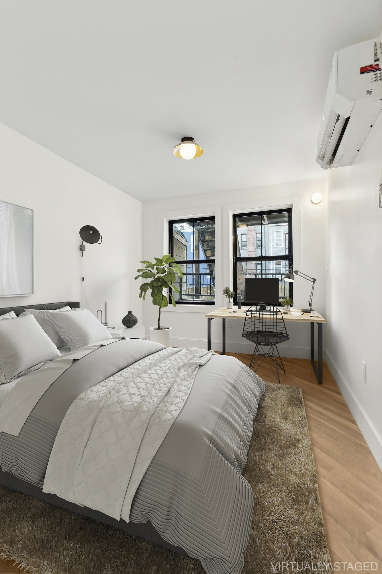 1265 Madison Street, Unit 1 Brooklyn, NY 11221 - Photo 10 of 11 a bed room with two bed and a couch