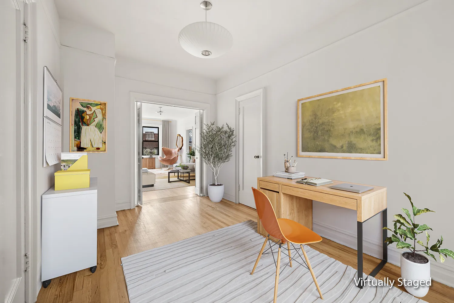a view of a dining room with furniture and a window