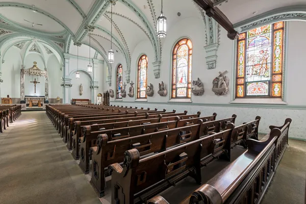 a large living with a clock on the top