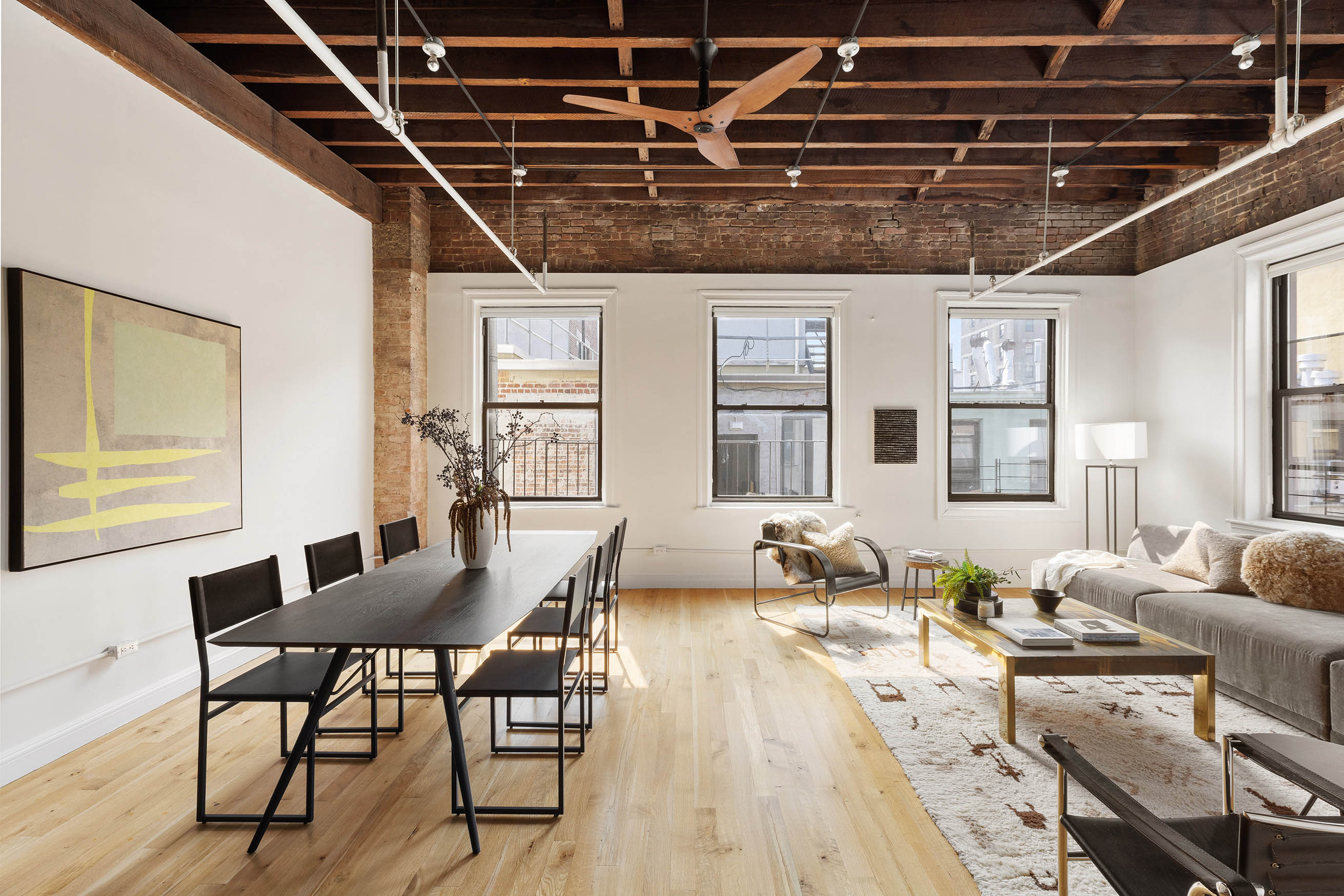84 Forsyth Street, Unit 5R Manhattan, NY 10002 - Photo 3 of 14 a view of a dining room with furniture window and wooden floor