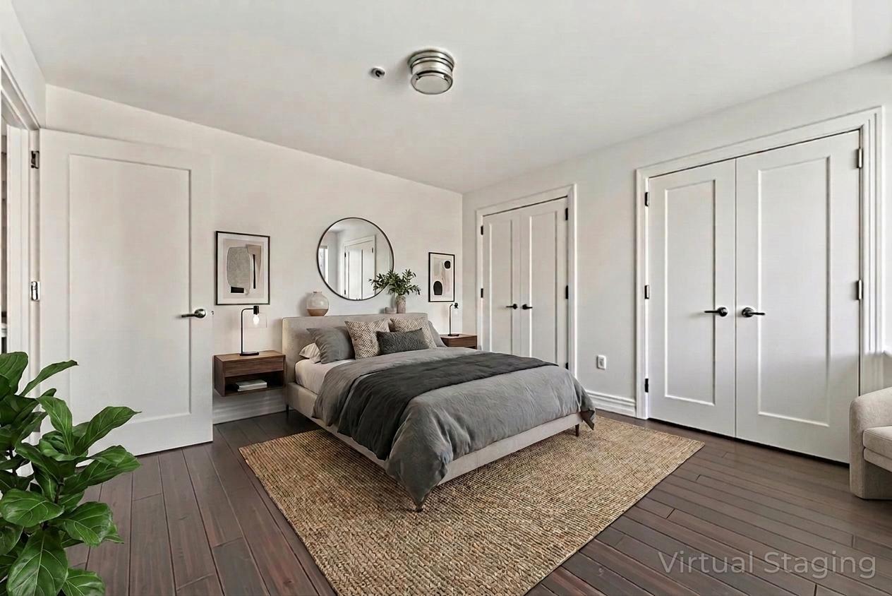 64-05 Yellowstone Boulevard, Unit 414 Queens, NY 11375 - Photo 3 of 14 a bed room with a bed and a potted plant