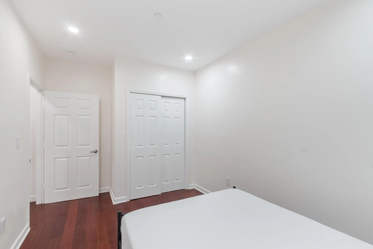 a view of hallway with wooden floor
