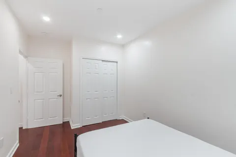 a view of hallway with wooden floor