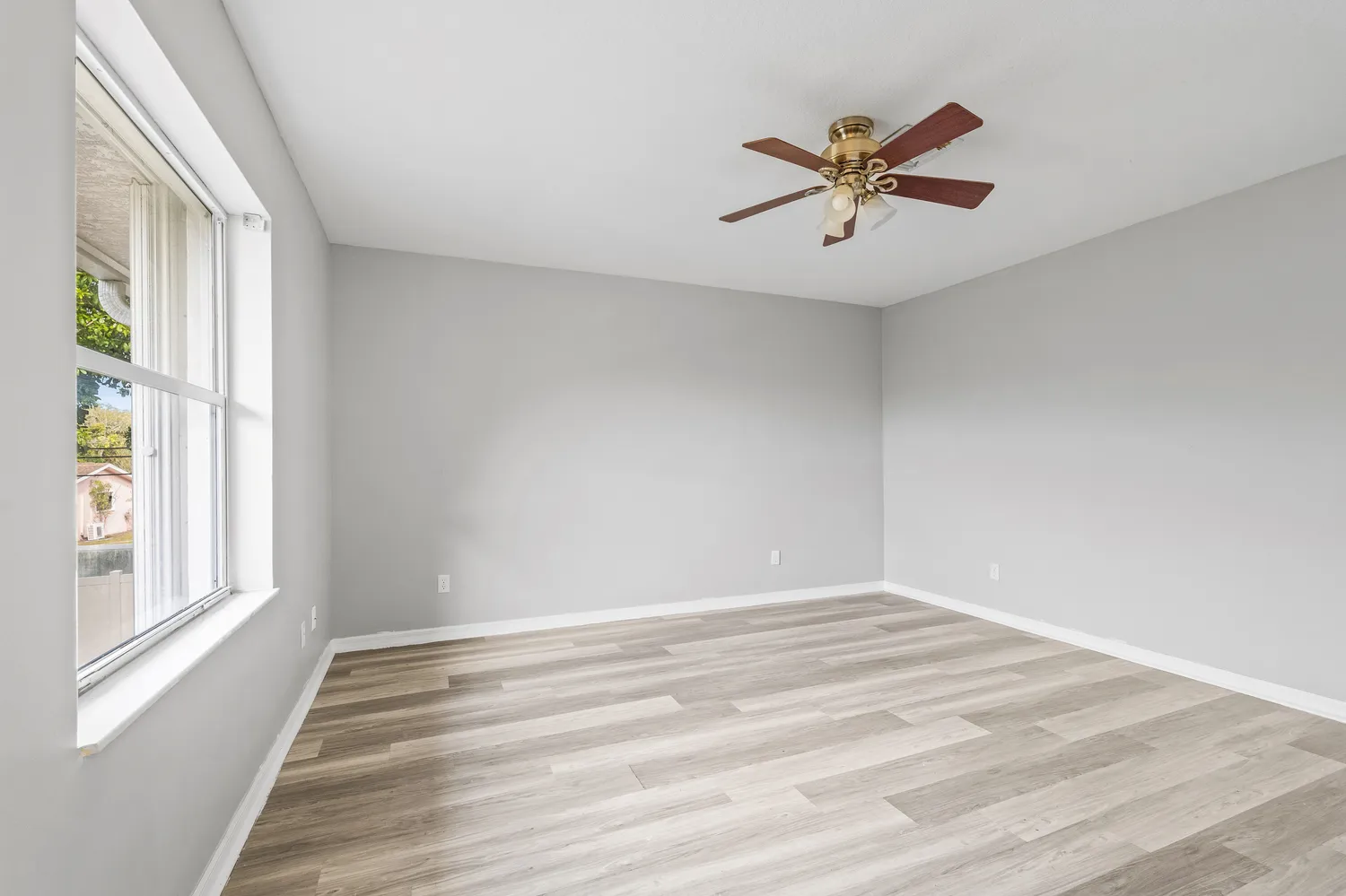 a view of a ceiling fan with wooden floor