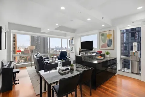 a living room with fireplace furniture and a flat screen tv