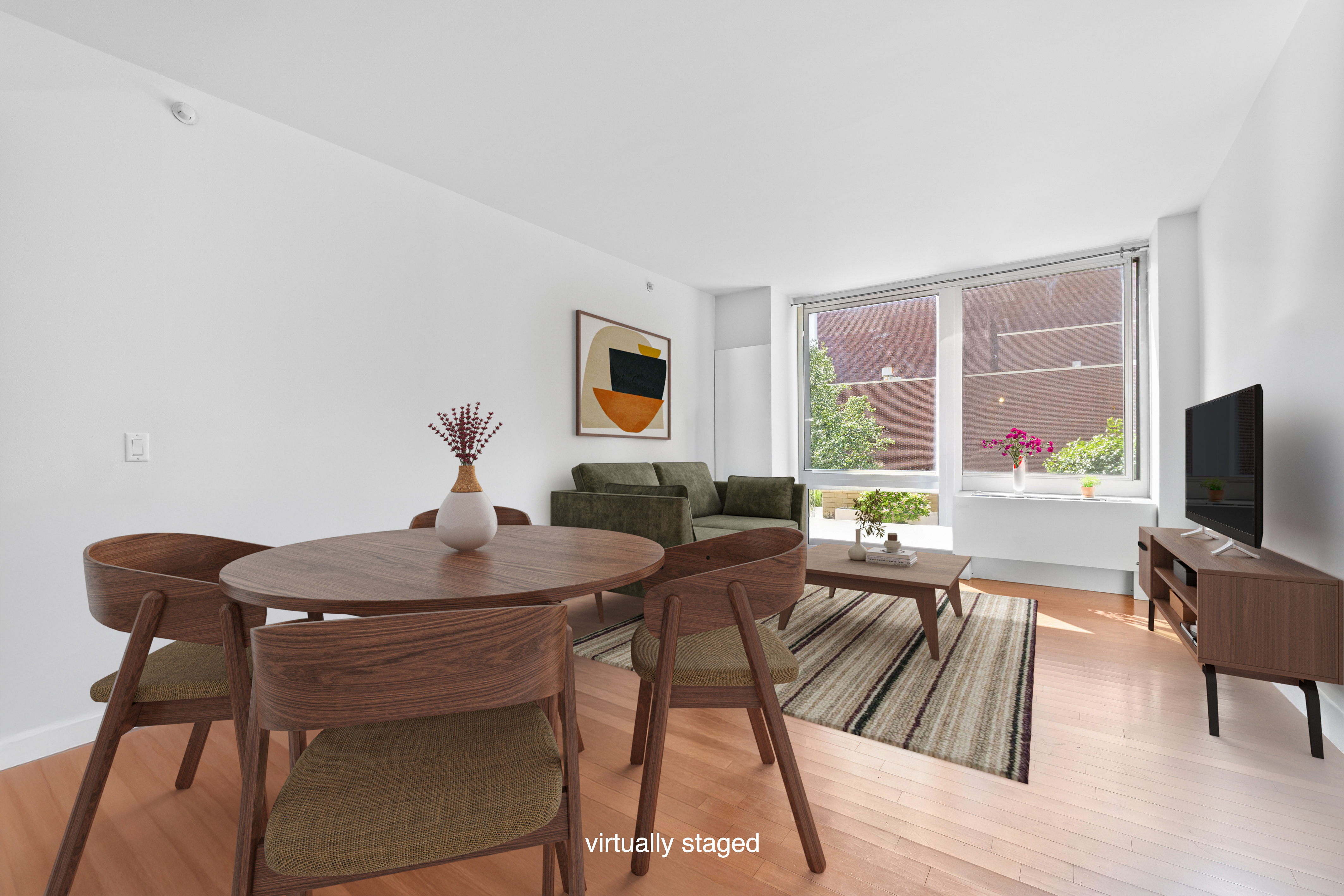 a view of a livingroom with furniture and a window