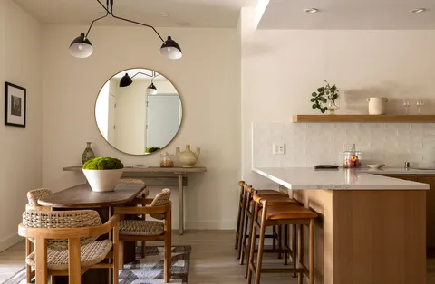 a picture of a room with a table and chairs