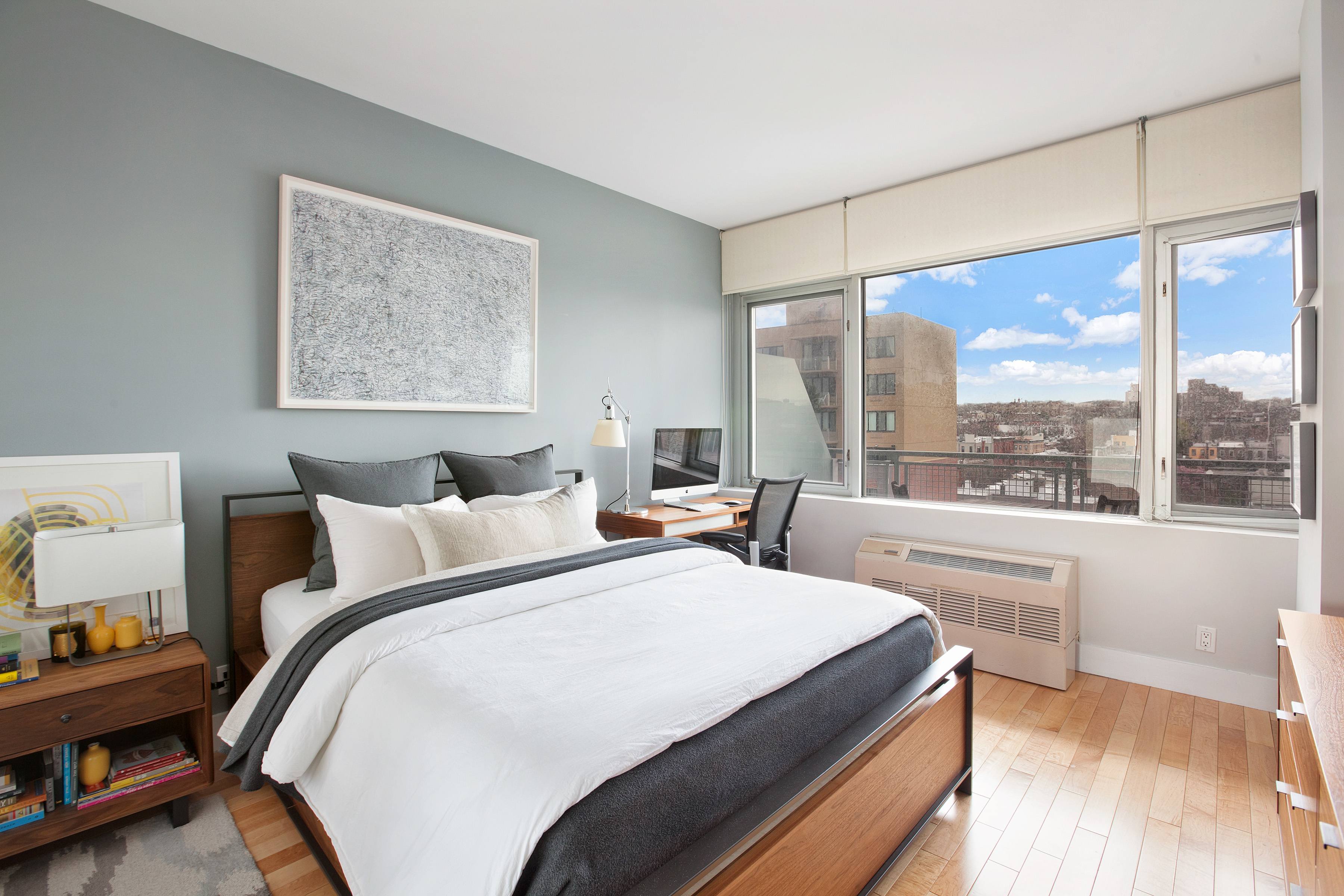 251 7th Street, Unit 10C Brooklyn, NY 11215 - Photo 8 of 15 a bedroom with a large bed and a large window with outer view