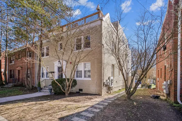 a view of a house with a snow in the yard