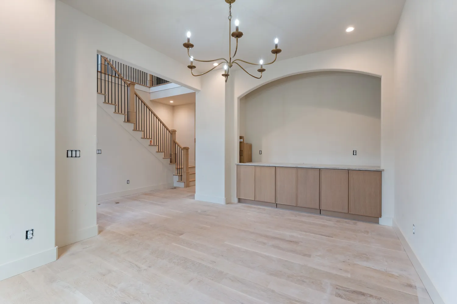 a large kitchen with kitchen island granite countertop a stove a sink a refrigerator and a sink