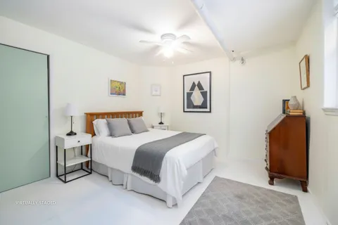 a spacious bedroom with a bed and a walk in closet