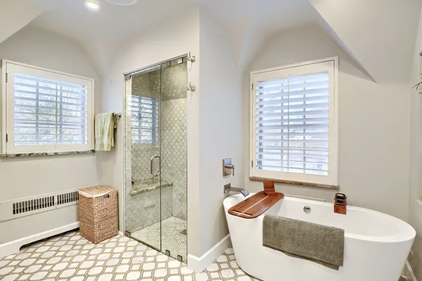 a bath room with a couch and a table