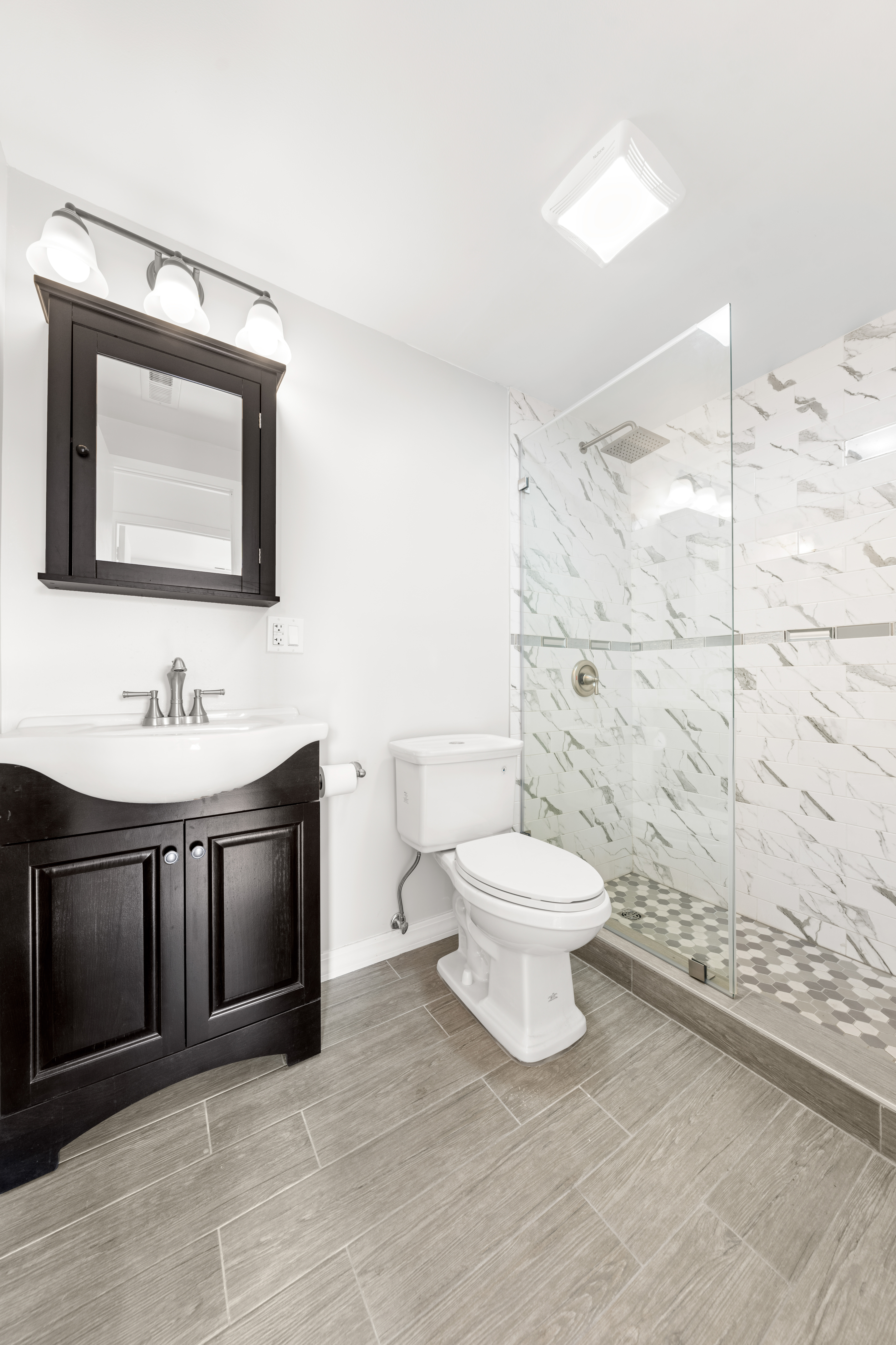 1050 Dekalb Avenue, Unit 2 Brooklyn, NY 11221 - Photo 8 of 10 a bathroom with a sink and a mirror