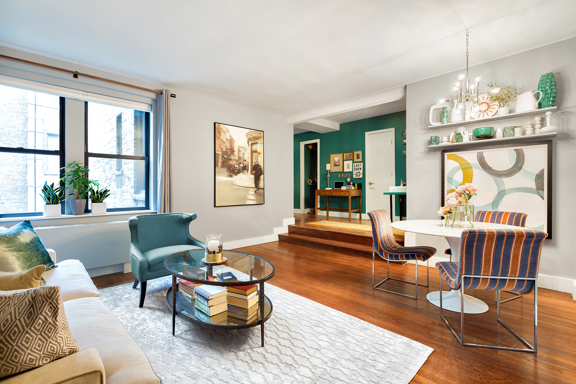 245 West 25th Street, Unit 3K Manhattan, NY 10001 - Photo 2 of 14 a living room with furniture and a large window