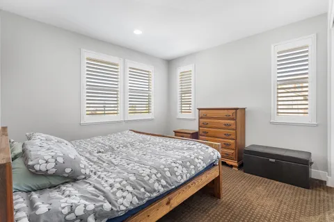a building outdoor space with patio furniture and potted plants