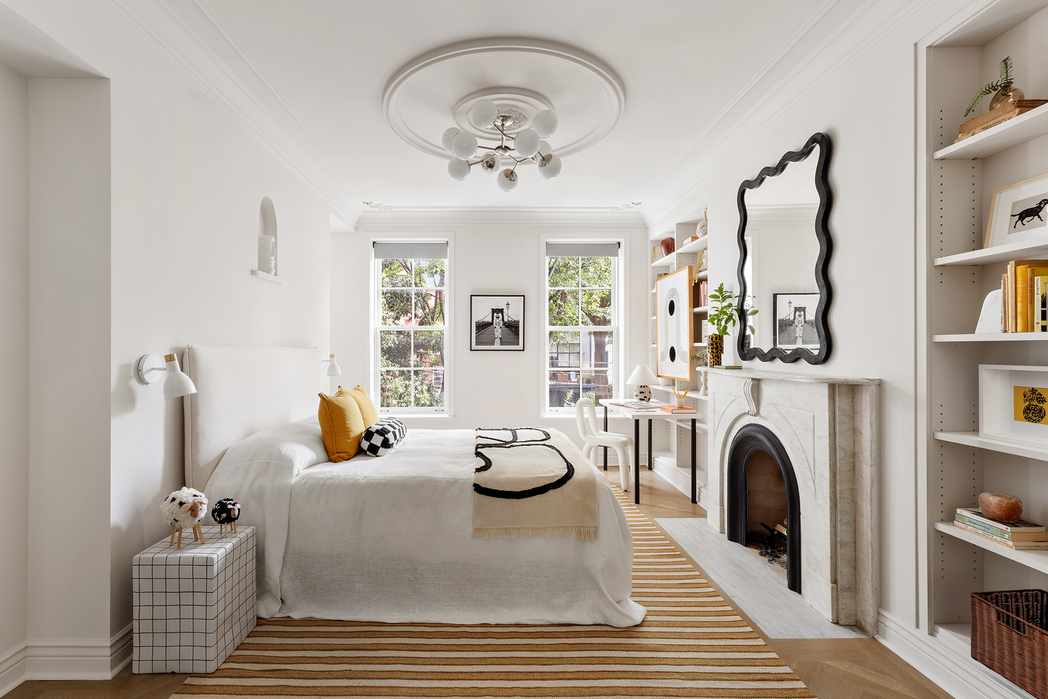 439 Sackett Street Brooklyn, NY 11231 - Photo 15 of 25 a living room with furniture a fireplace and a book shelf