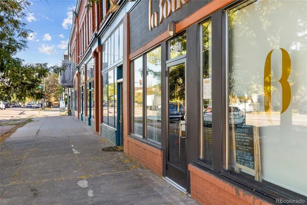 a view of a cafe with sitting area