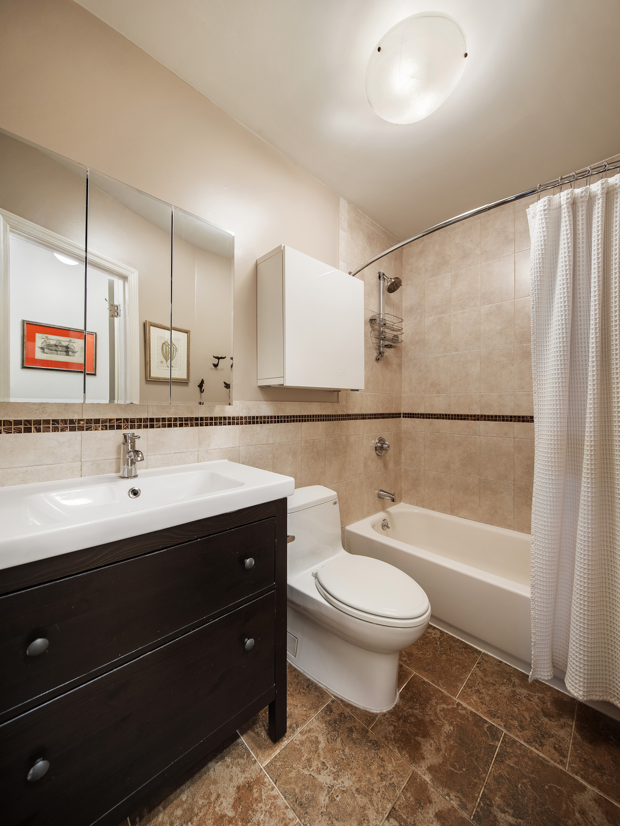 114 Pioneer Street Brooklyn, NY 11231 - Photo 9 of 17 a bathroom with a sink a toilet a mirror and shower