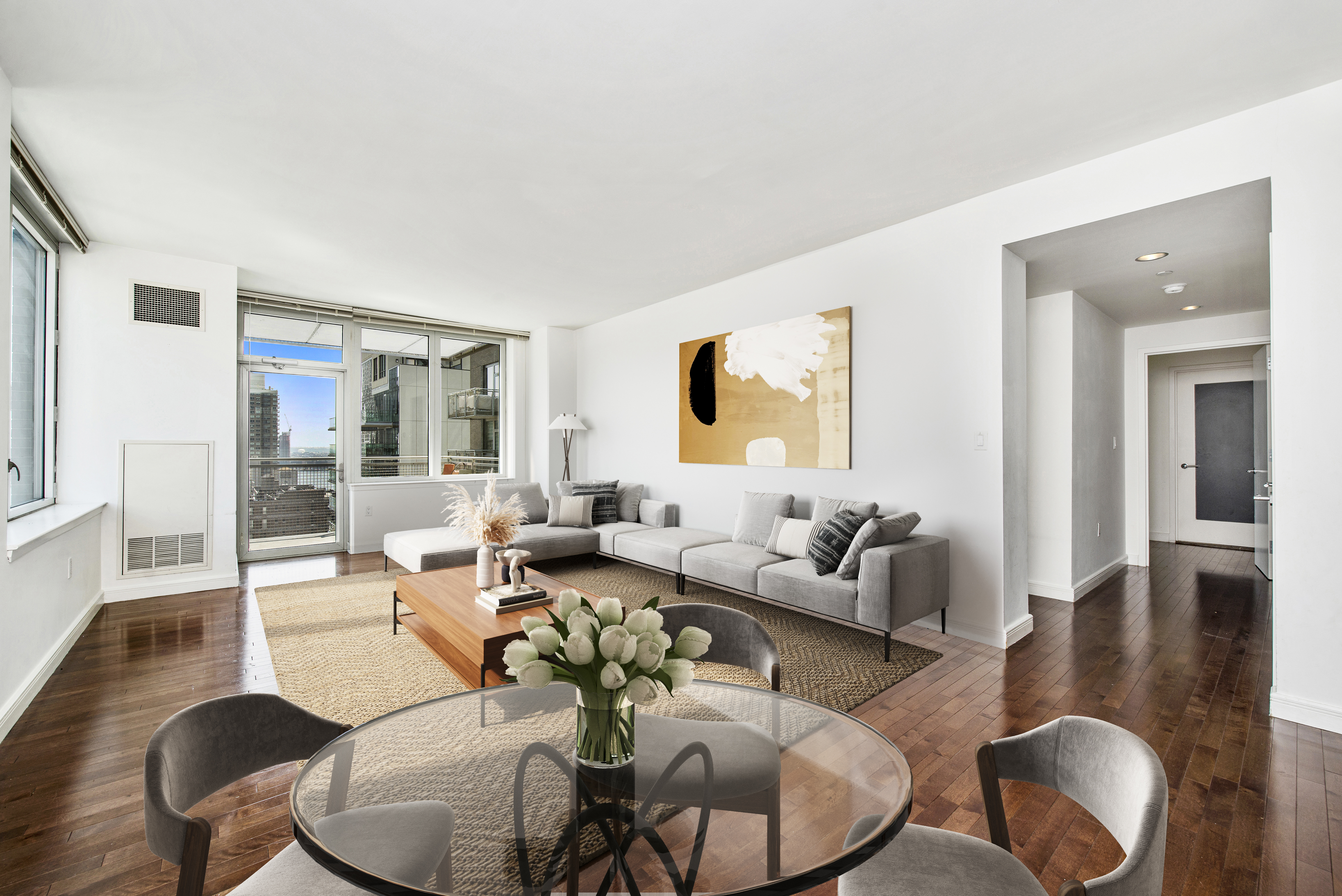 225 East 34th Street, Unit 17B Manhattan, NY 10016 - Photo 1 of 24 a living room with furniture or couch and a wooden floor