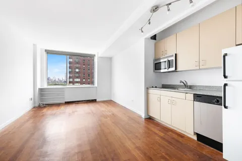 a view of a kitchen with electric appliances