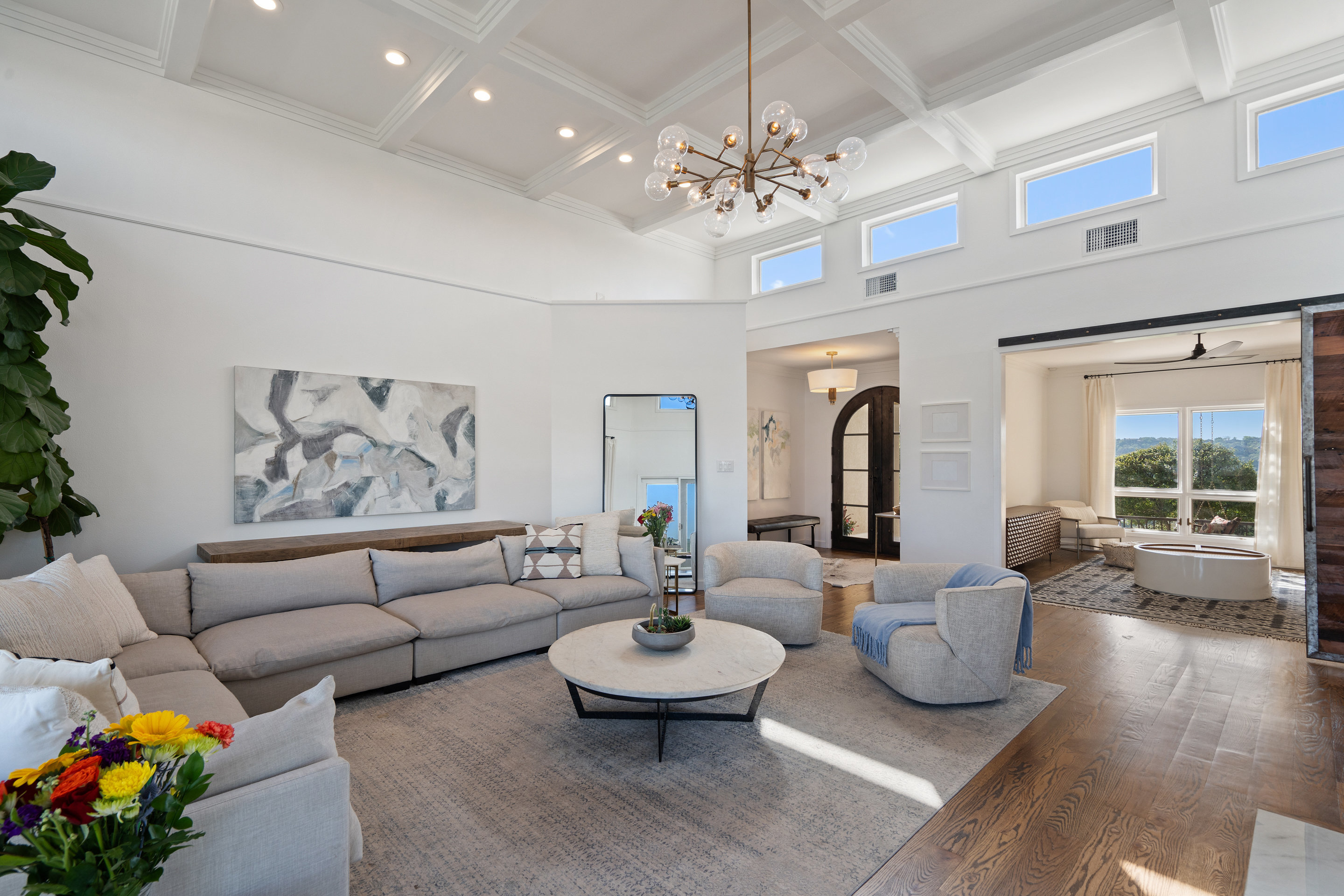 5319 Backtrail Drive Austin, TX 78731 - Photo 11 of 35 a living room with furniture chandelier and a large window