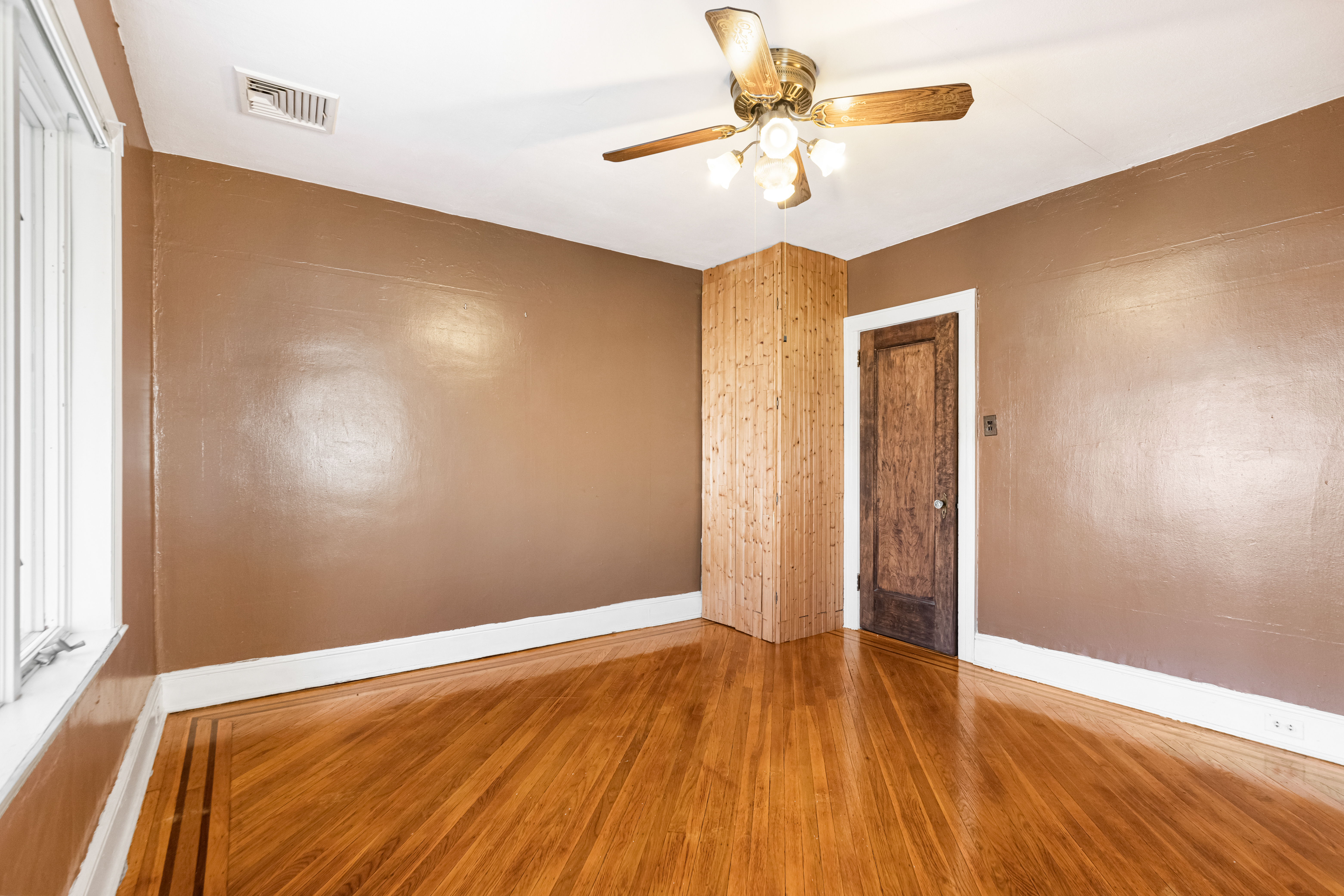 1874 Ryder Street Brooklyn, NY 11234 - Photo 11 of 20 wooden floor in an empty room with a window