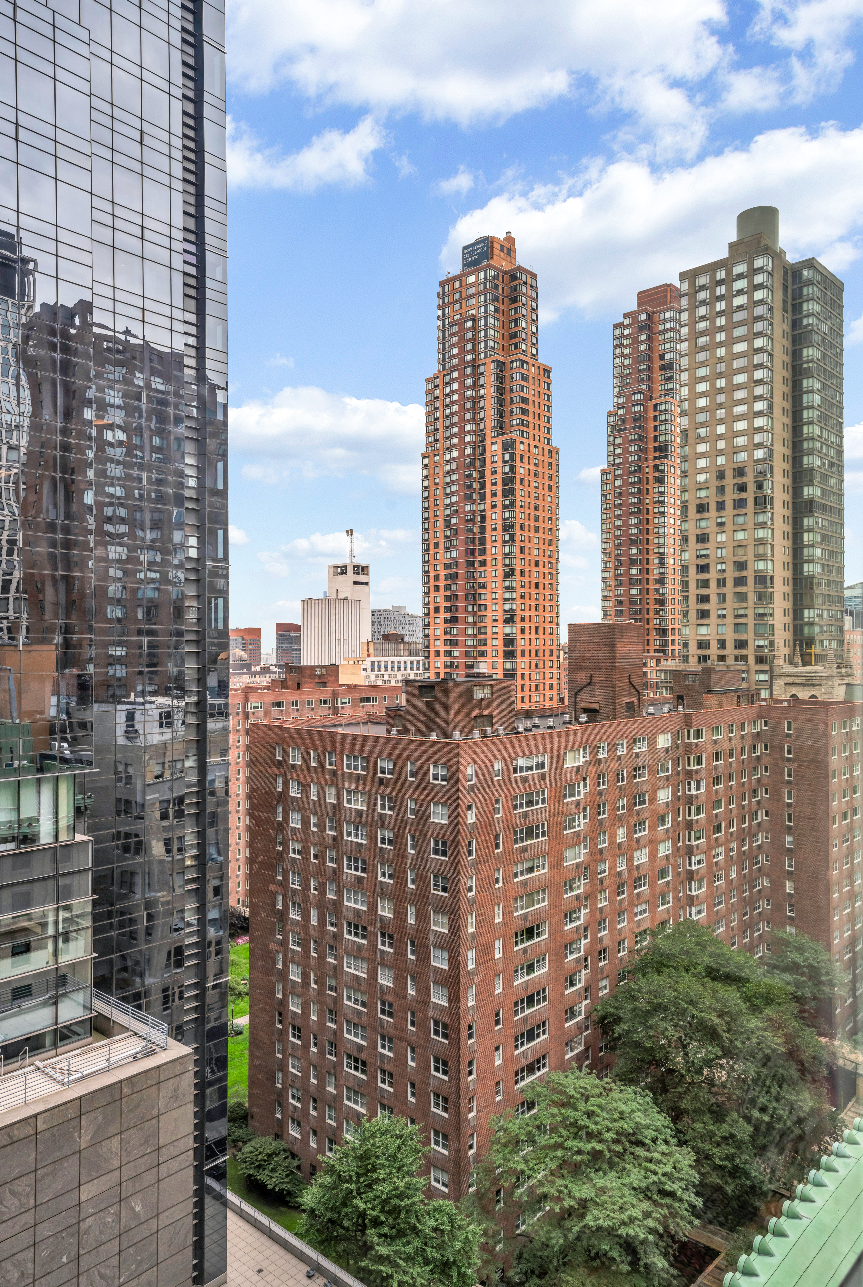 1 West 60th Street, Unit 16C Manhattan, NY 10019 - Photo 6 of 8 a view of a city with tall buildings