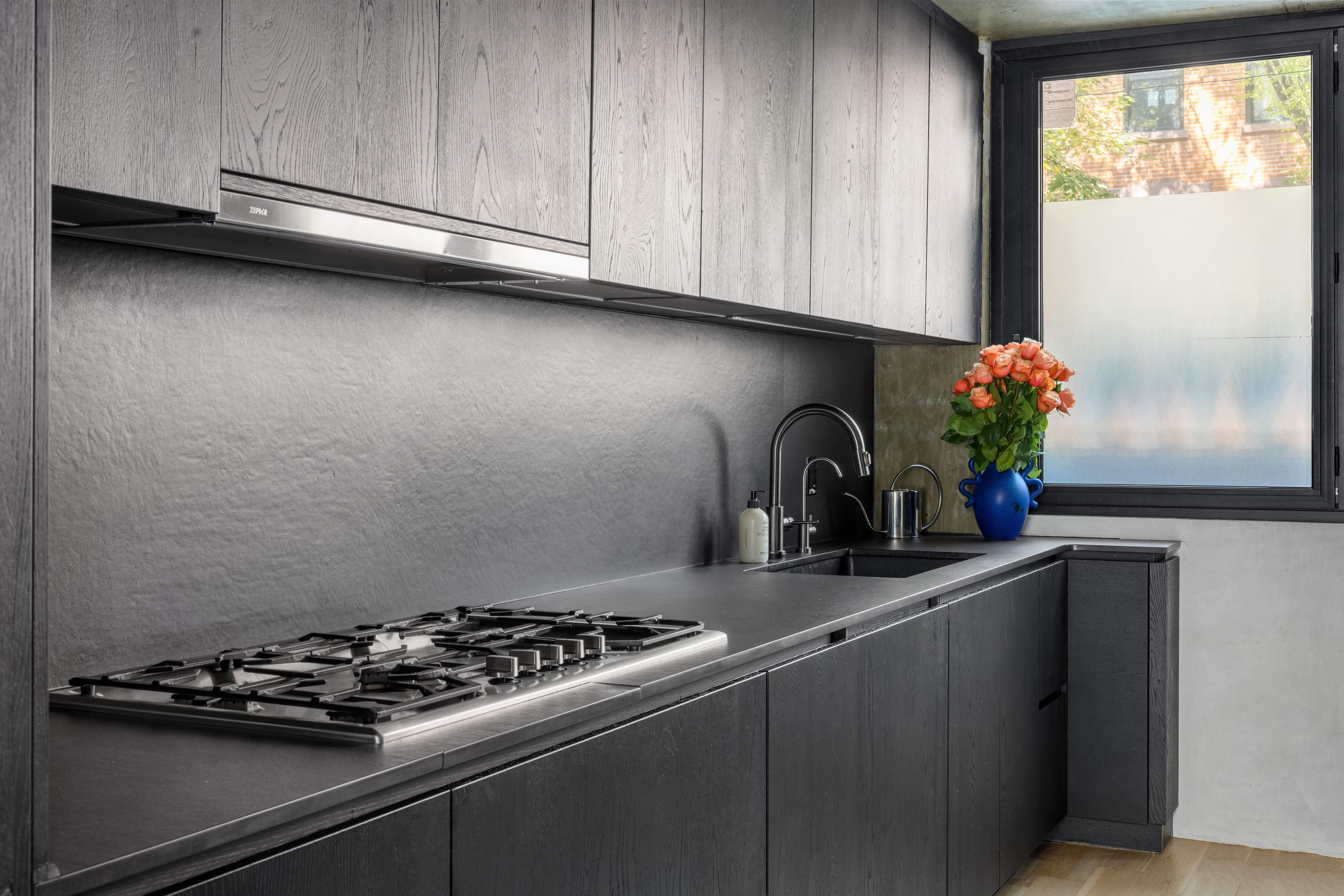 126 South 2nd Street, Unit GARDEN Brooklyn, NY 11249 - Photo 11 of 30 a close view of a sink a stove and cabinets in a kitchen